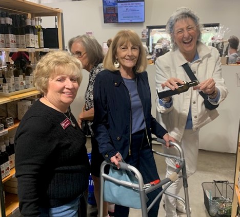 Lynn, Nina, & Janet buy olive oils